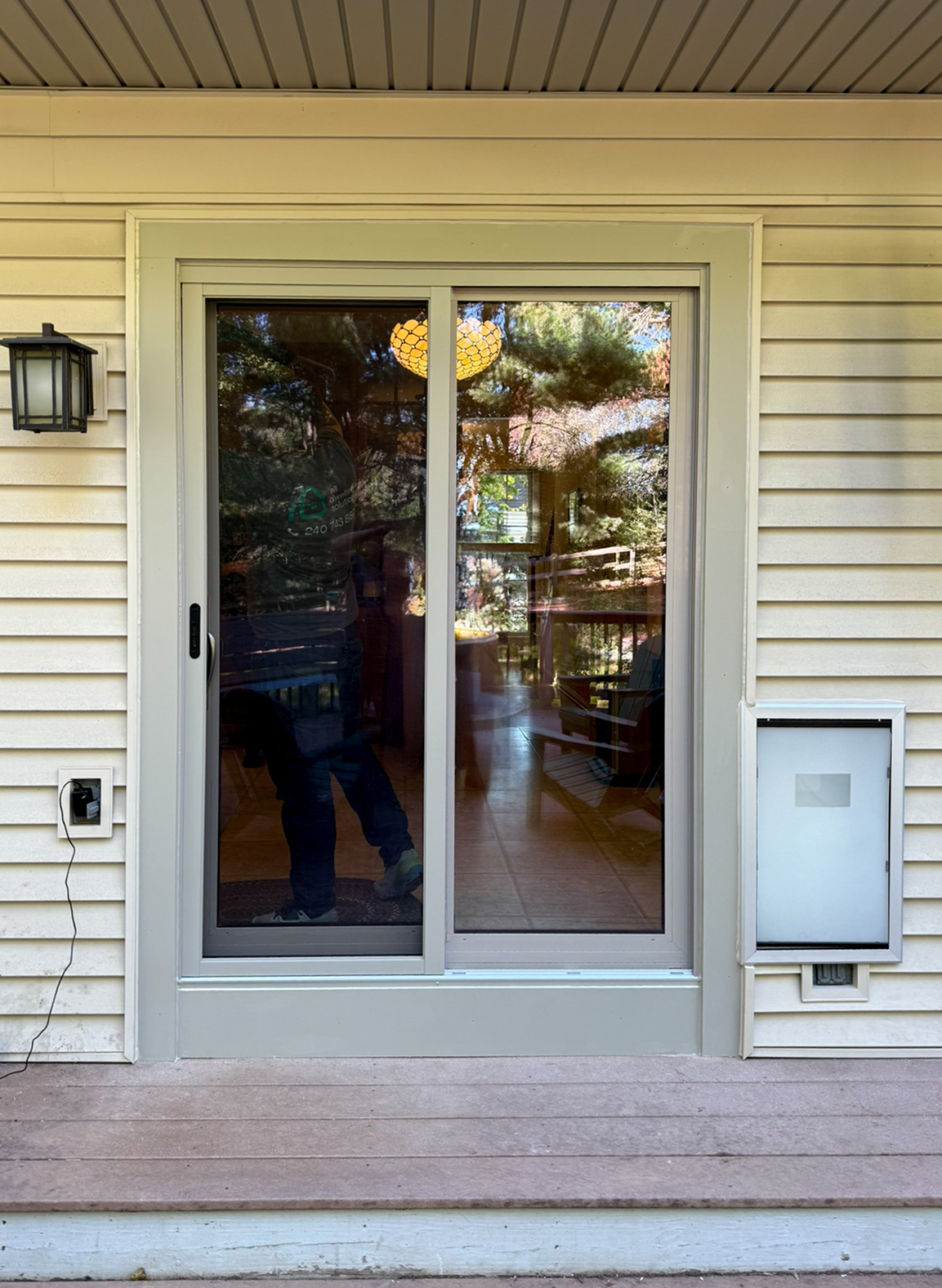 Patio Door Replacement and Wall Dog Door Installation project main photo.