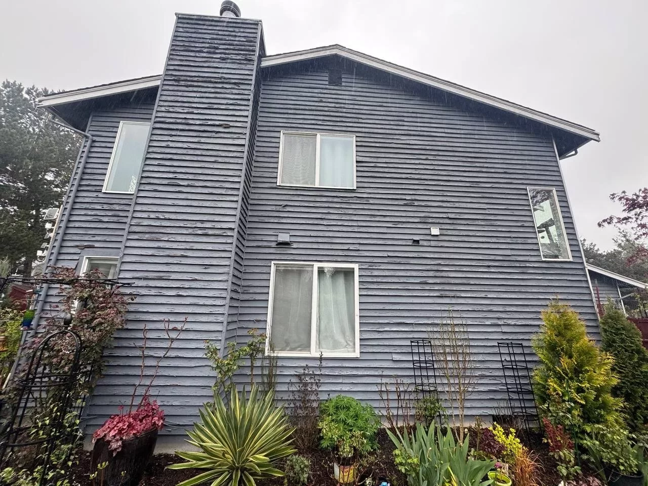 Upper exterior of gray-painted Everett home after siding and painting project