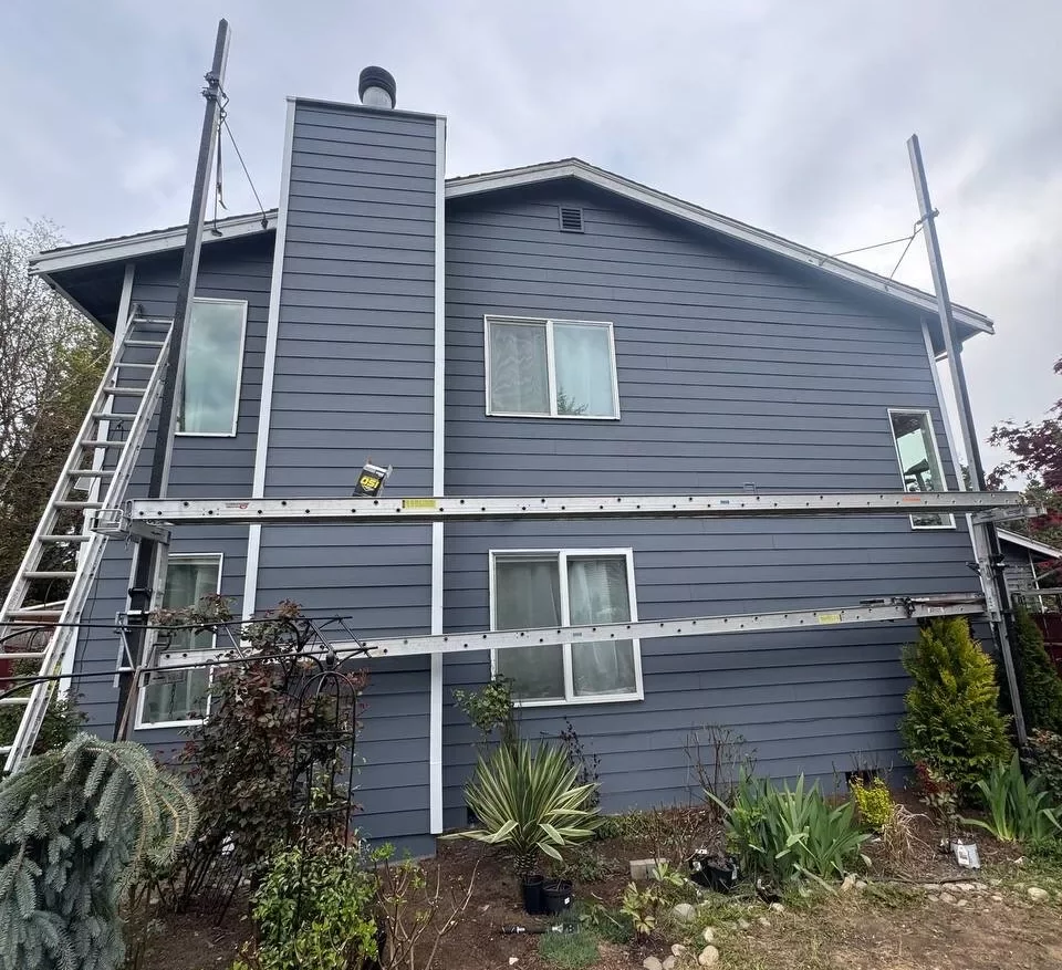 Front view of finished gray siding and exterior paint on Everett, WA house with chimney